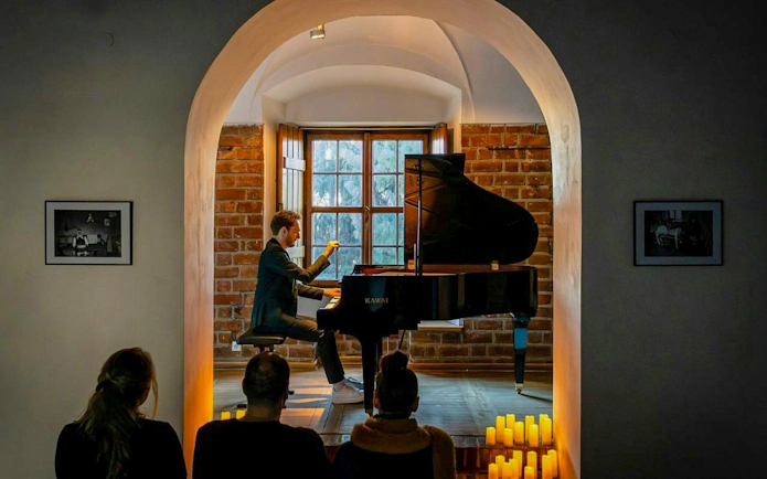 Pianist performing at Chopin Concert, Royal Castle Complex, Warsaw.