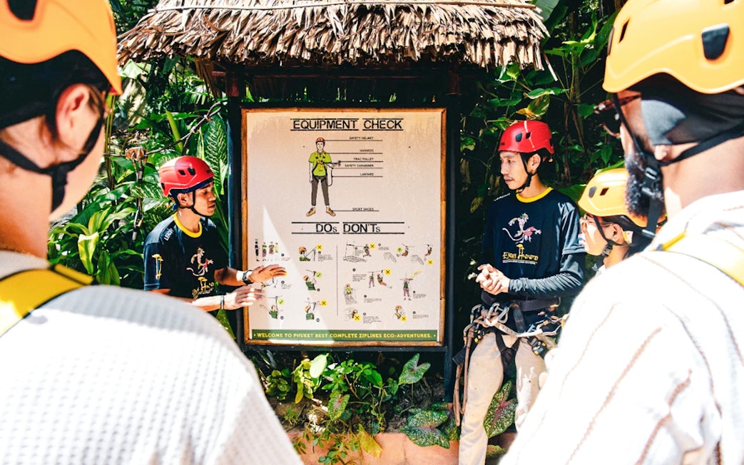 Participants receiving safety instructions for Flying Hanuman zipline tour in Phuket.