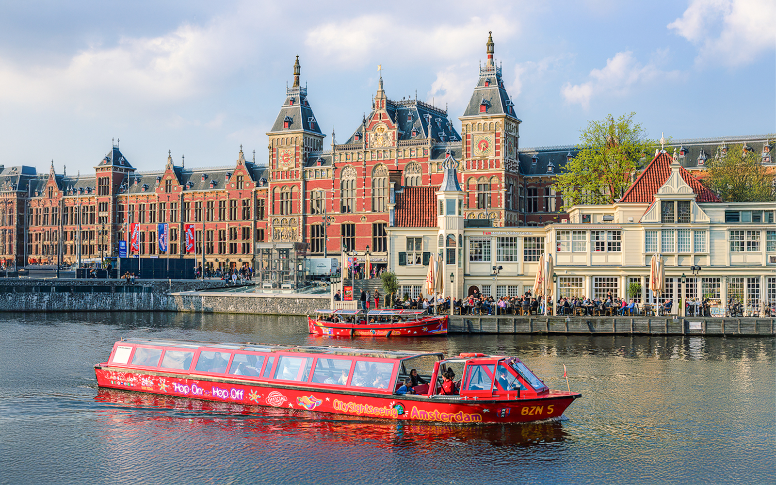 City Sightseeing Amsterdam Hop On Hop Off boat near Amsterdam Centraal Station.