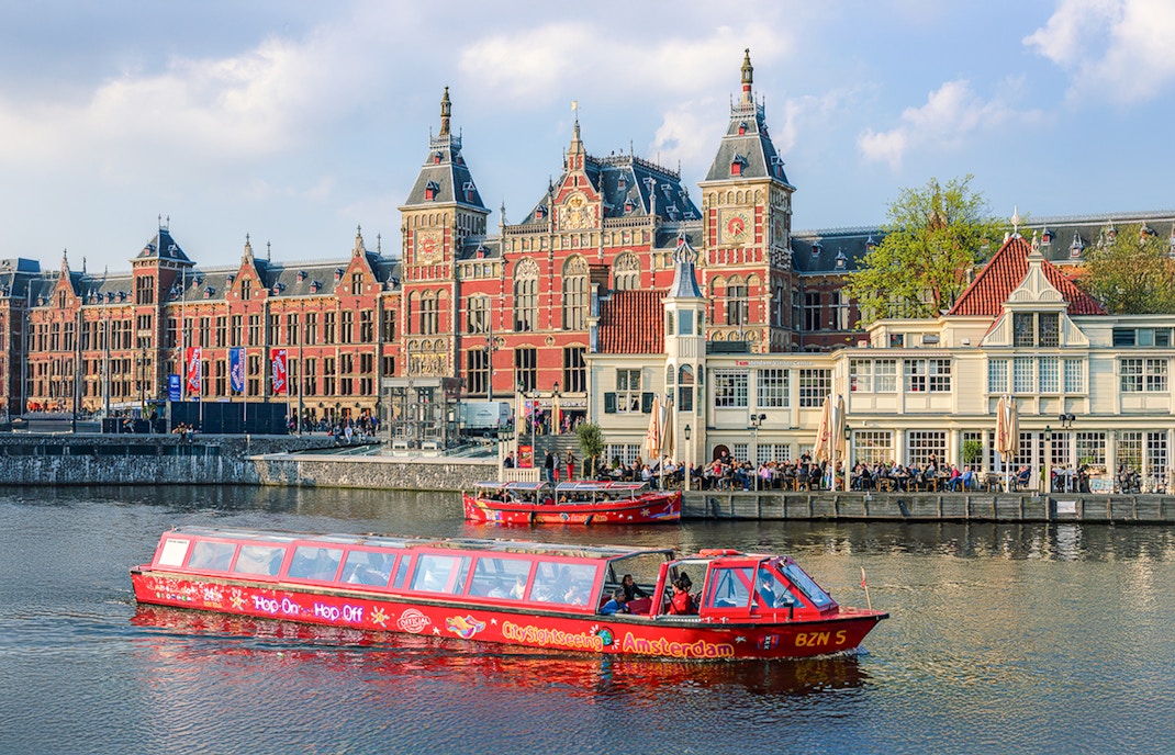 City Sightseeing Amsterdam Hop On Hop Off boat near Amsterdam Centraal Station.