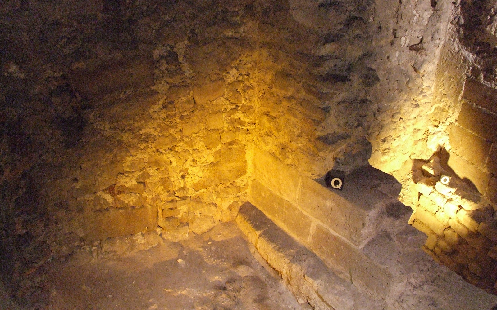 Stone walls inside Notre-Dame Archaeological Crypt in Paris.