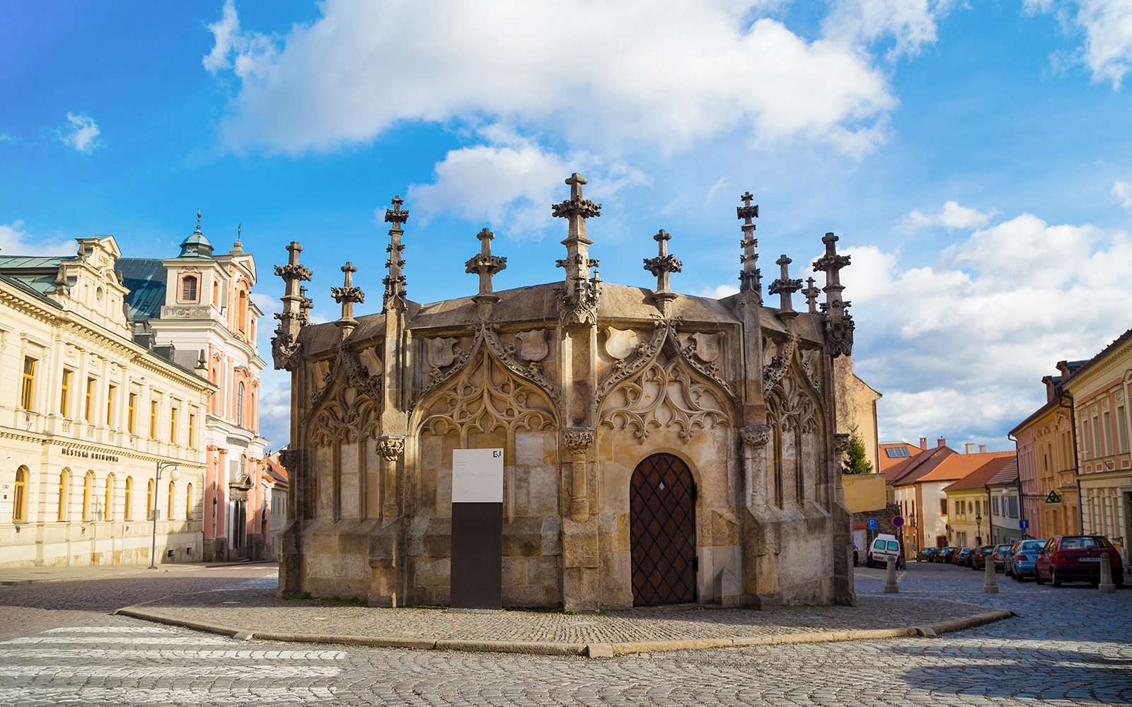 Gothic Stone Fountain in Kutna Hora, Czech Republic, on a cobblestone street.