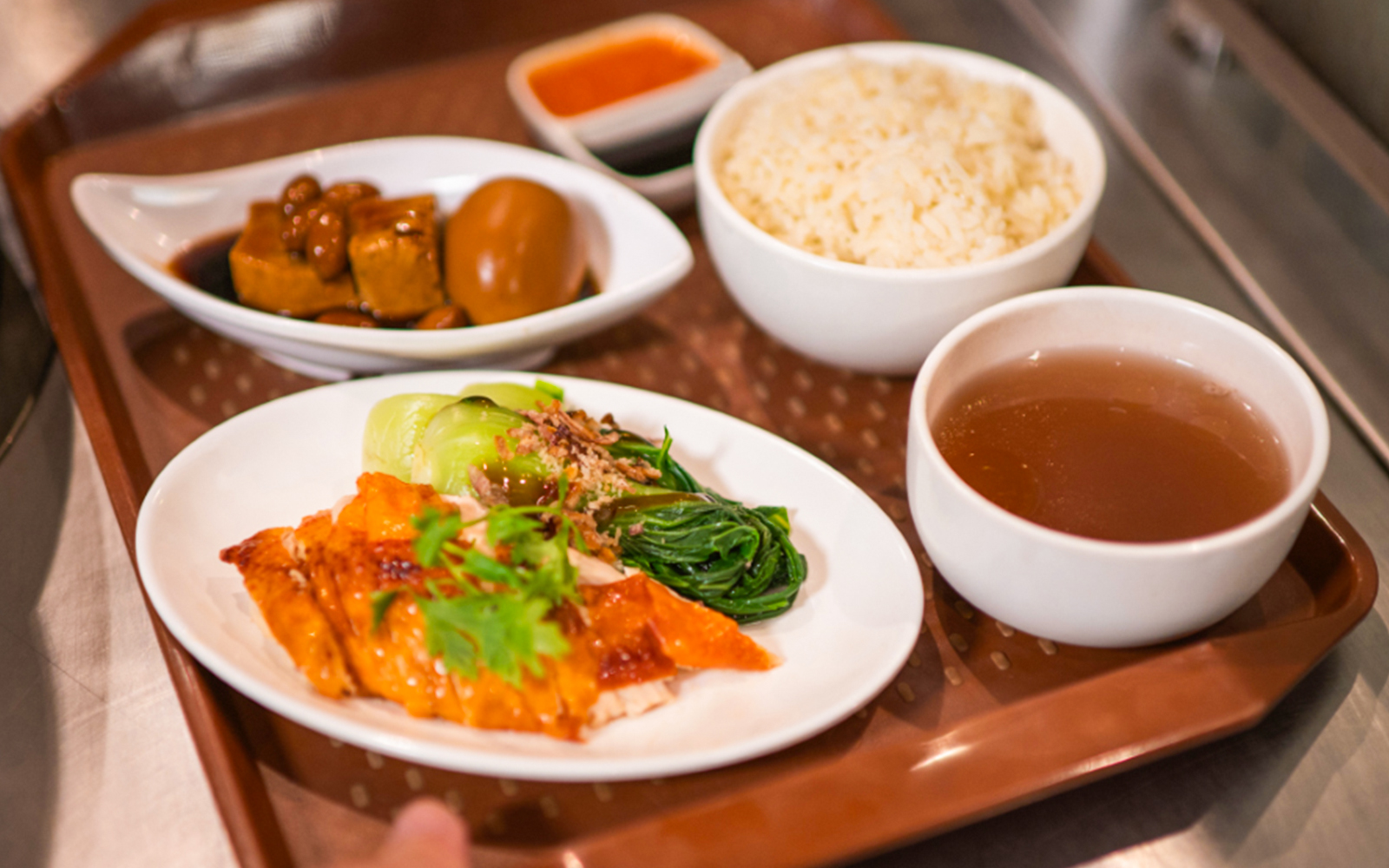 Traditional Asian meal with rice, soup, and vegetables served at Ulu Ulu Dinner, Night Safari.
