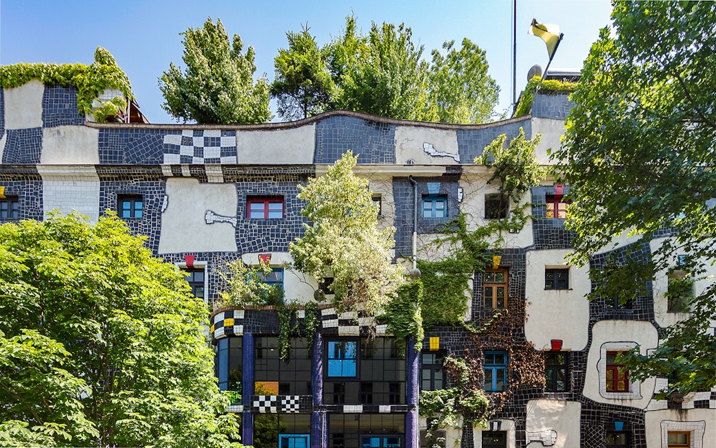KUNST HAUS WIEN facade with colorful windows and greenery in Vienna.