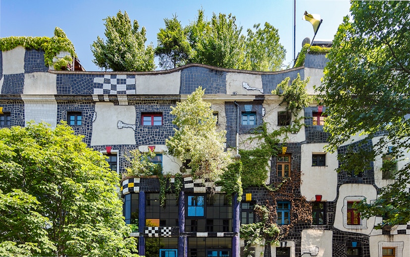 KUNST HAUS WIEN facade with colorful windows and greenery in Vienna.