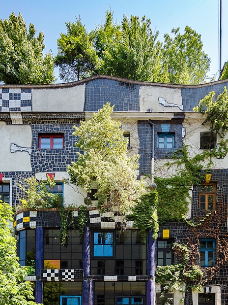 KUNST HAUS WIEN facade with colorful windows and greenery in Vienna.