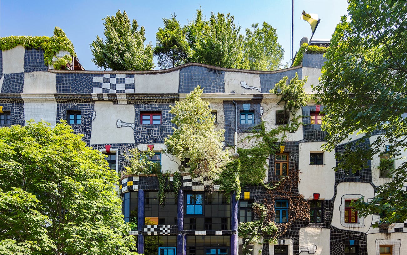KUNST HAUS WIEN facade with colorful windows and greenery in Vienna.