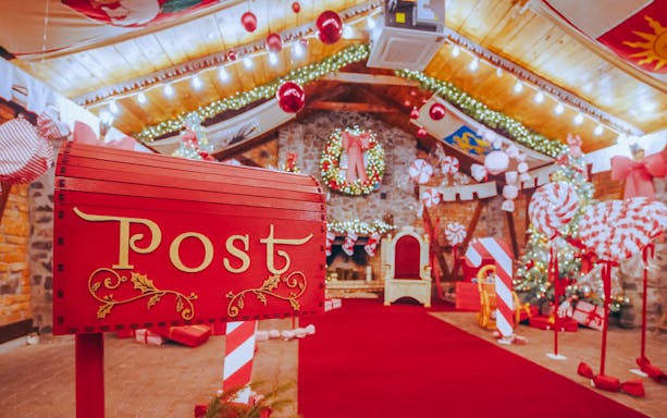 Santa's post office with festive decorations and Christmas lights.