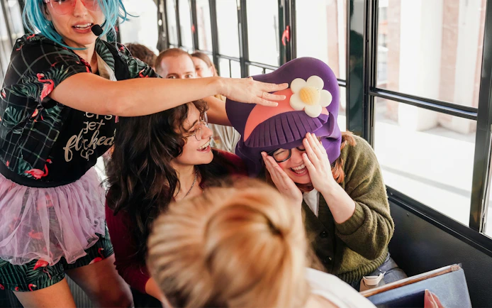 Tour guide entertaining passengers on Savannah for Morons Trolley Tour.