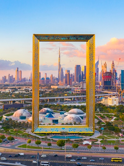 Dubai Frame with city skyline in the background, showcasing iconic architecture.