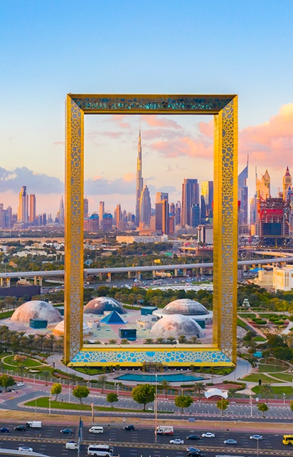 Dubai Frame with city skyline in the background, showcasing iconic architecture.
