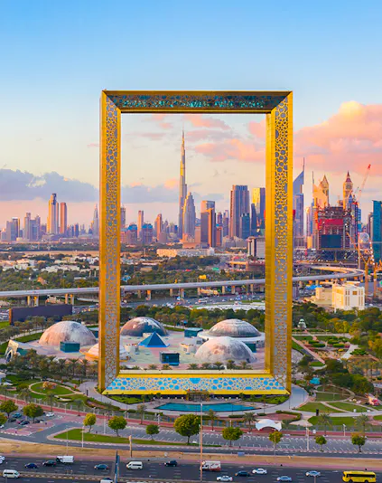 Dubai Frame with city skyline in the background, showcasing iconic architecture.