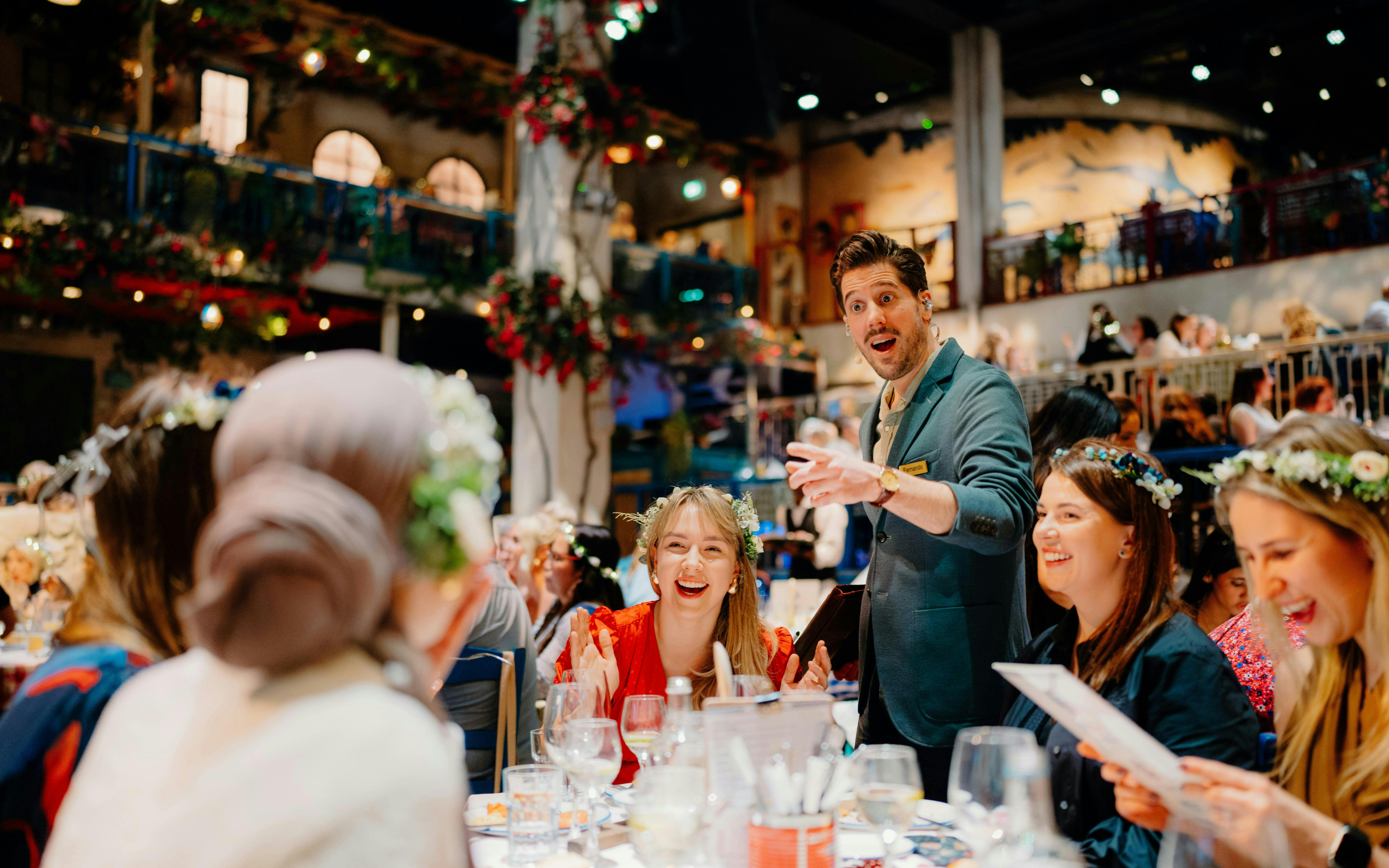 Guests enjoying dinner and entertainment at Mamma Mia! The Party event.