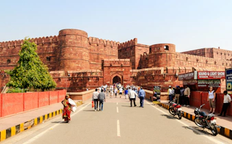 Visitors entering Agra Fort, a key stop on the Delhi: Taj Mahal Private Sunrise Tour.