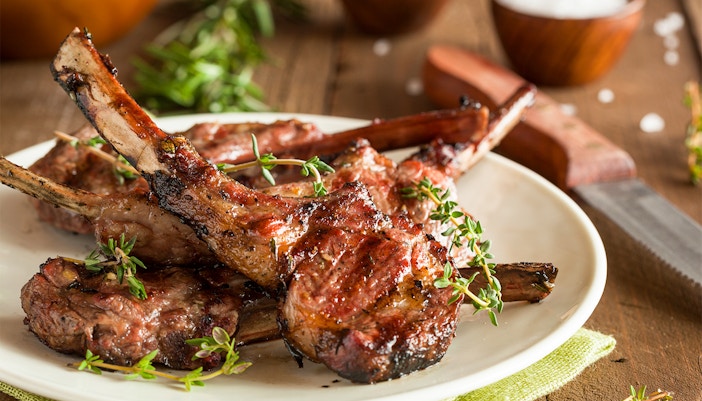 Grilled lamb chops with herbs on a plate