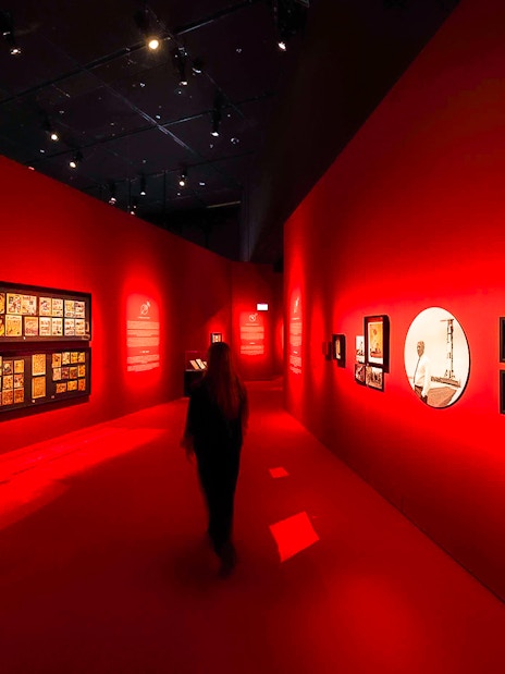 Exhibition hall with red walls displaying art at Singapore Future World Exhibition.