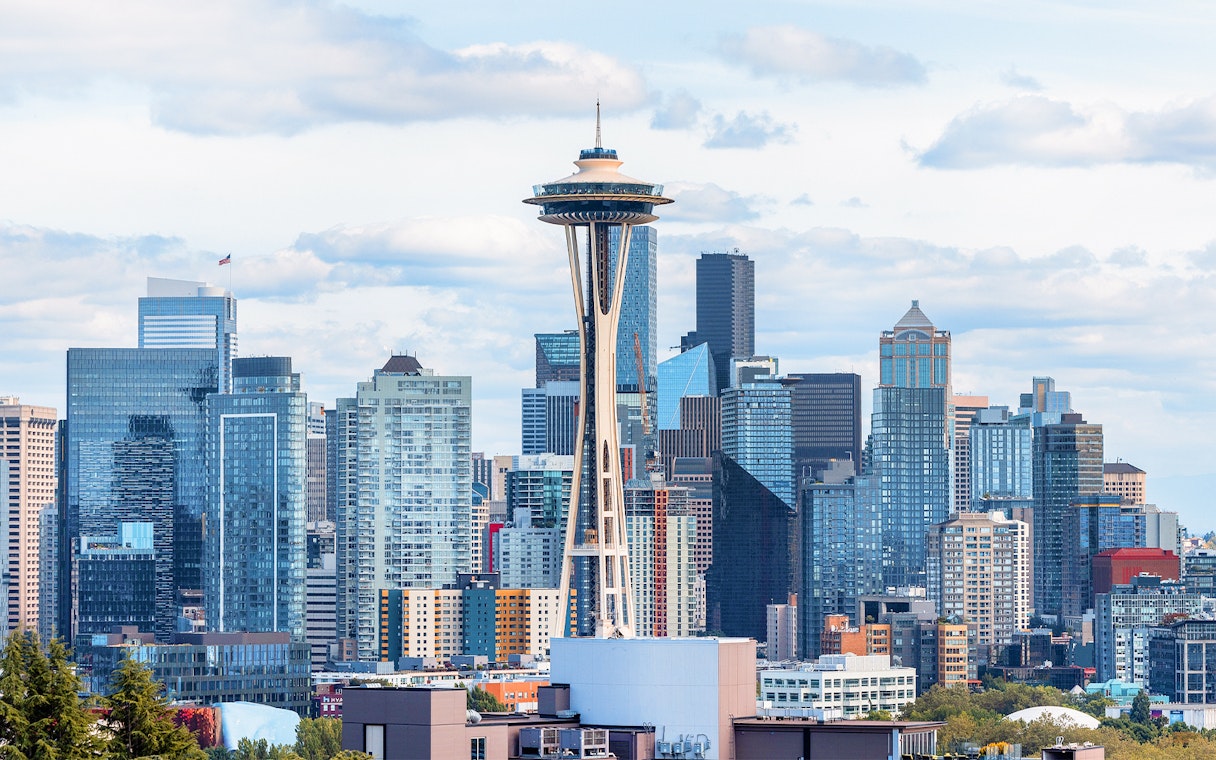Seattle skyline featuring the Space Needle with surrounding skyscrapers.