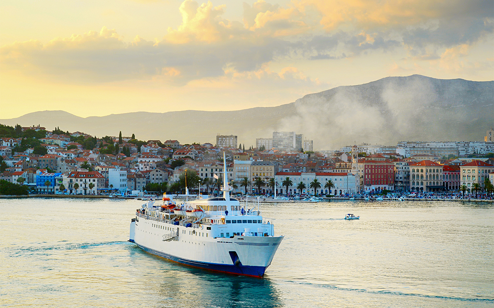 Cruise sailing in the sea with Split town view in the background, Croatia