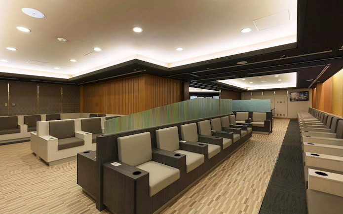 Waiting area seating at Narita International Airport Terminal 1 lounge.
