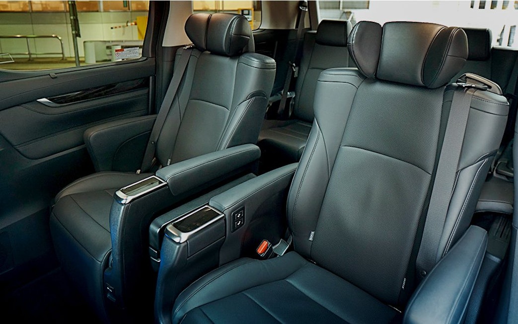 Interior seating of shuttle transfer to Tokyo Disneyland.