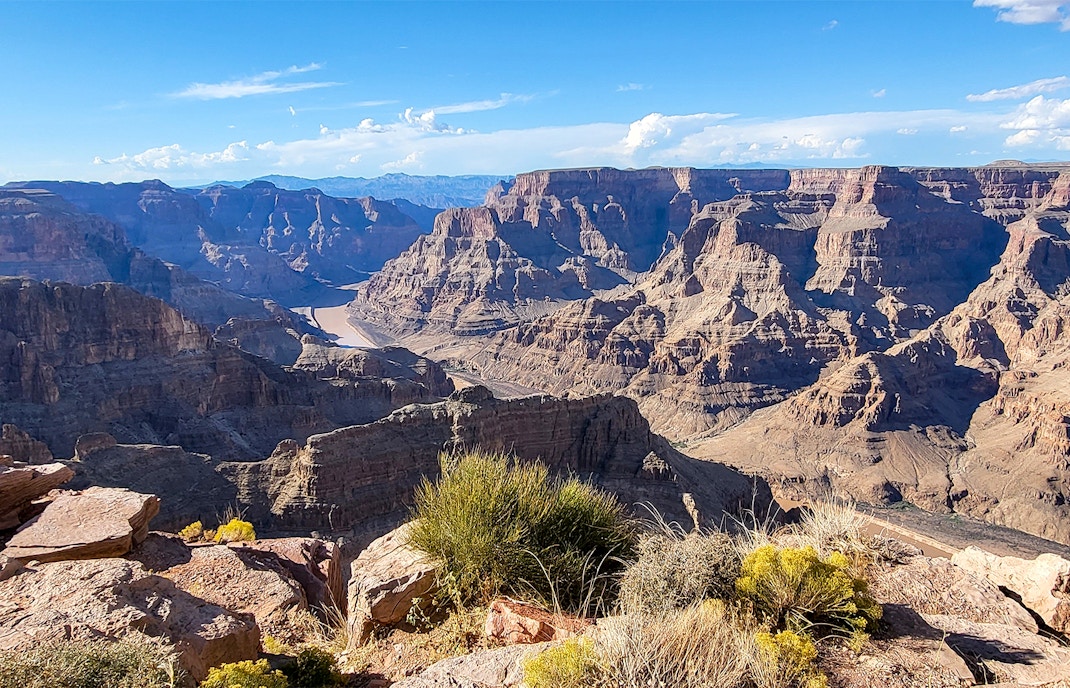 Grand Canyon West Rim with scenic view of canyon cliffs and Colorado River.