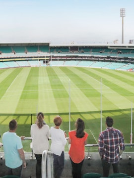Visitors overlooking the Sydney Cricket Ground field in Australia.