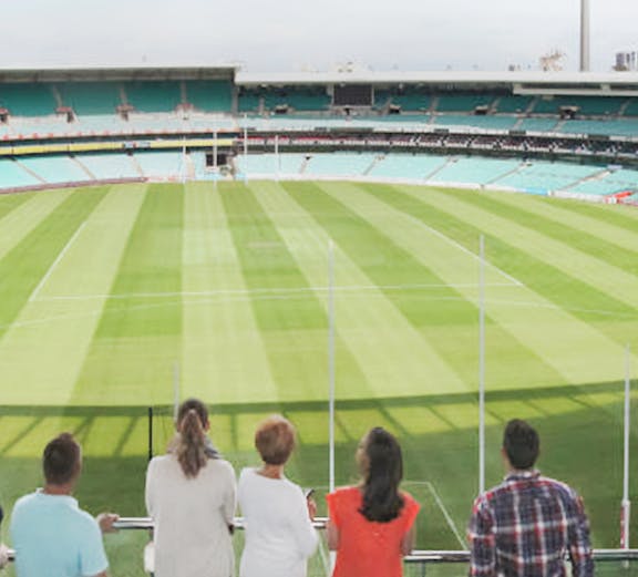 Visitors overlooking the Sydney Cricket Ground field in Australia.