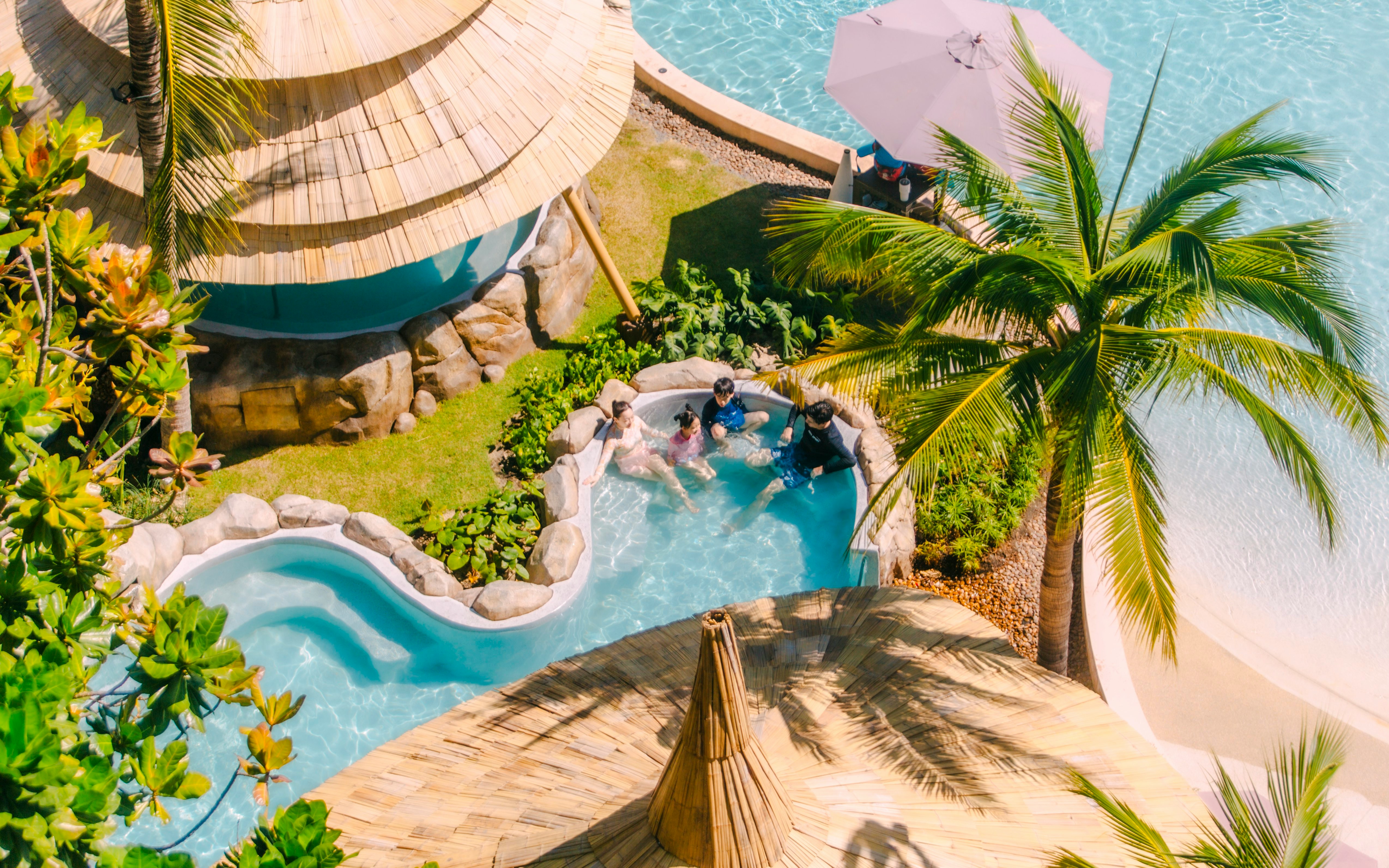 Visitors relaxing in a pool at Vana Nava Water Jungle, Hua Hin.