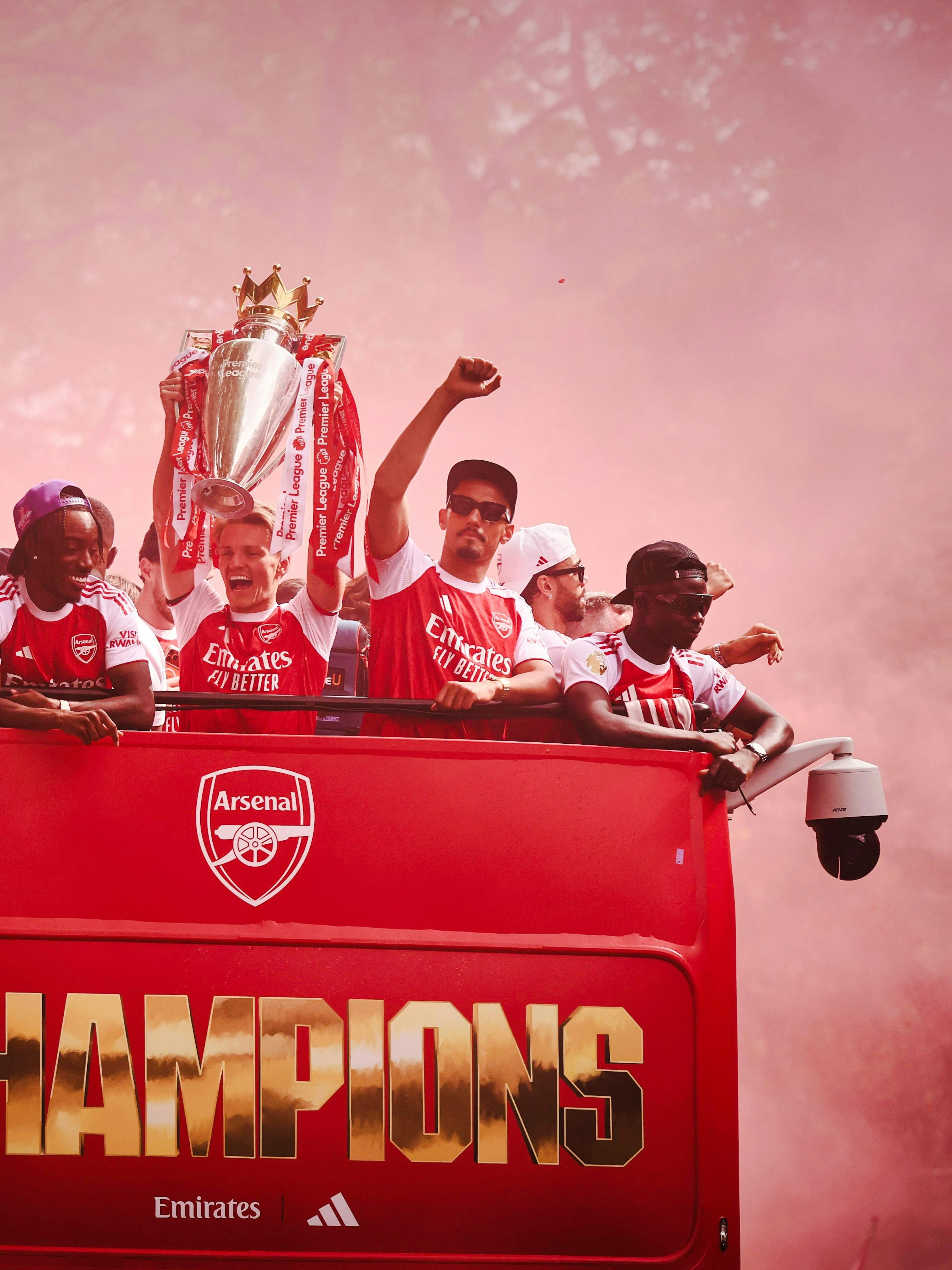 Arsenal players celebrate on an open-top bus during the 2026 Premier League Champions Parade.