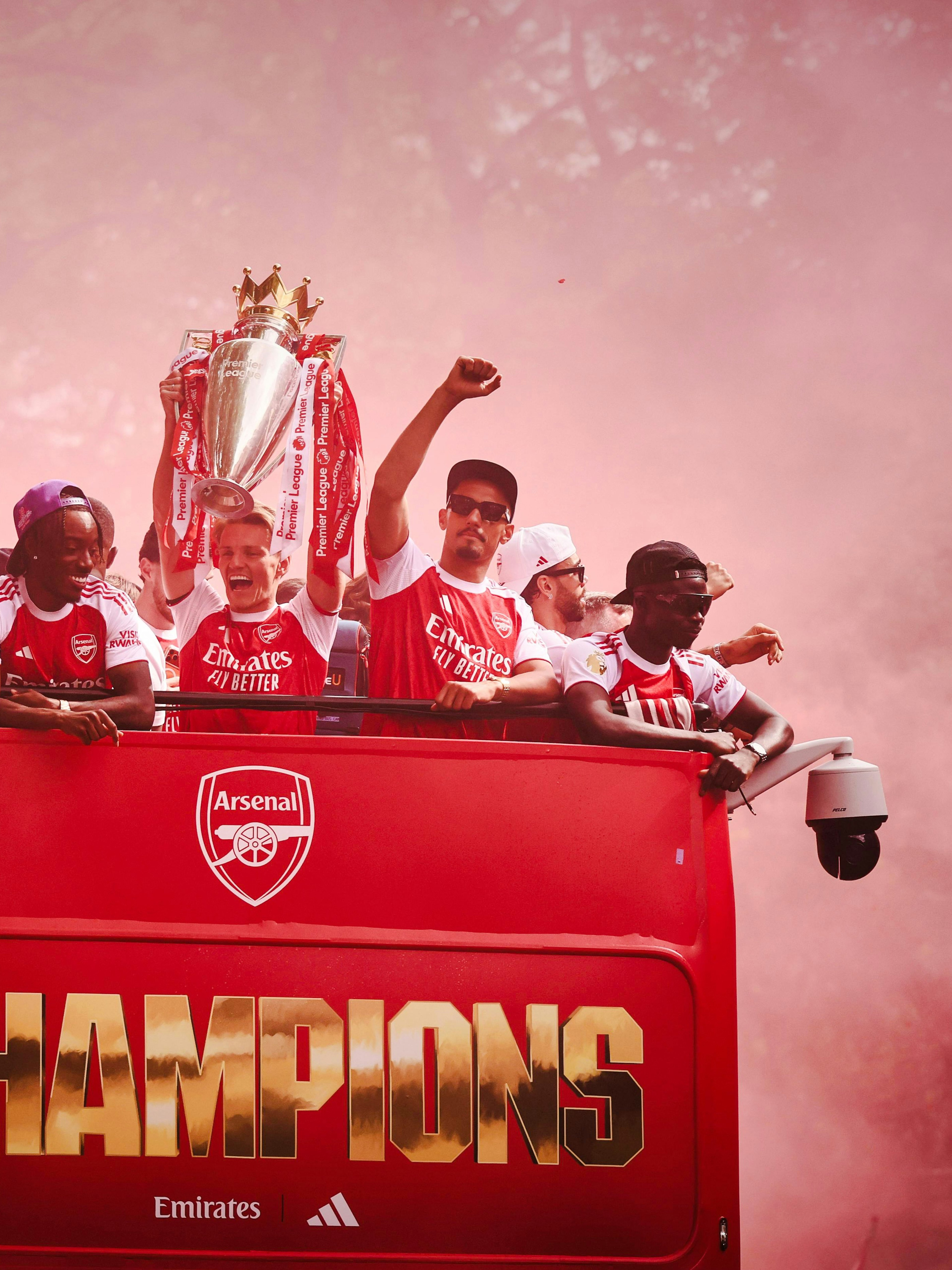 Arsenal players celebrate on an open-top bus during the 2026 Premier League Champions Parade.