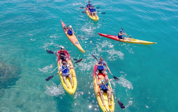 Kayakers paddling in the Adriatic Sea near Podstrana.
