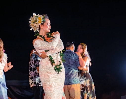 Mauka Warriors Luau performers in traditional attire during a wedding dance show in Hawaii.