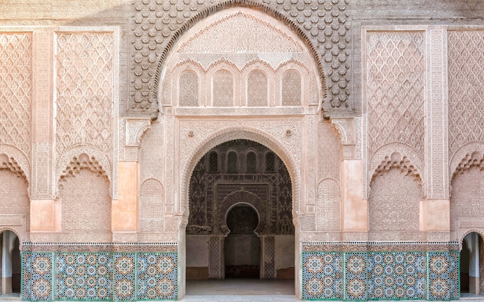 Madrasa Ben Youssef intricate archway and detailed tilework in Marrakech, Morocco.