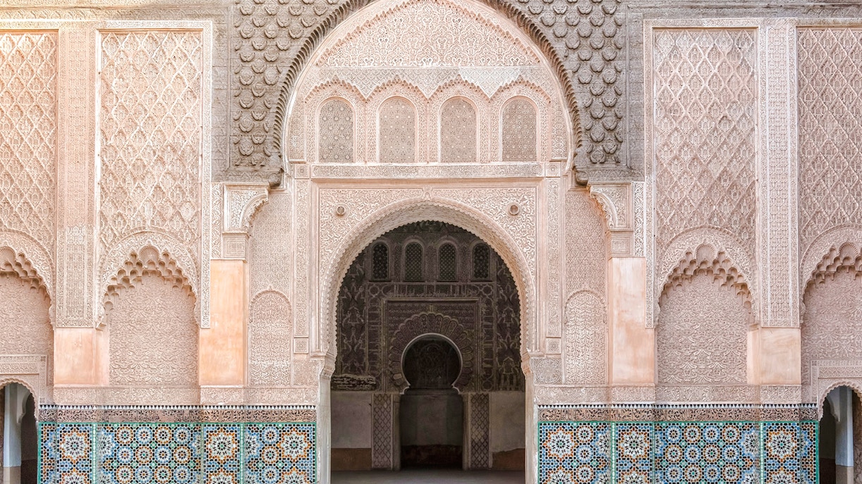 Madrasa Ben Youssef intricate archway and detailed tilework in Marrakech, Morocco.