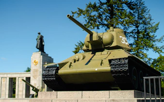 Soviet war memorial with tank and statue, Berlin Third Reich and Cold War tour.