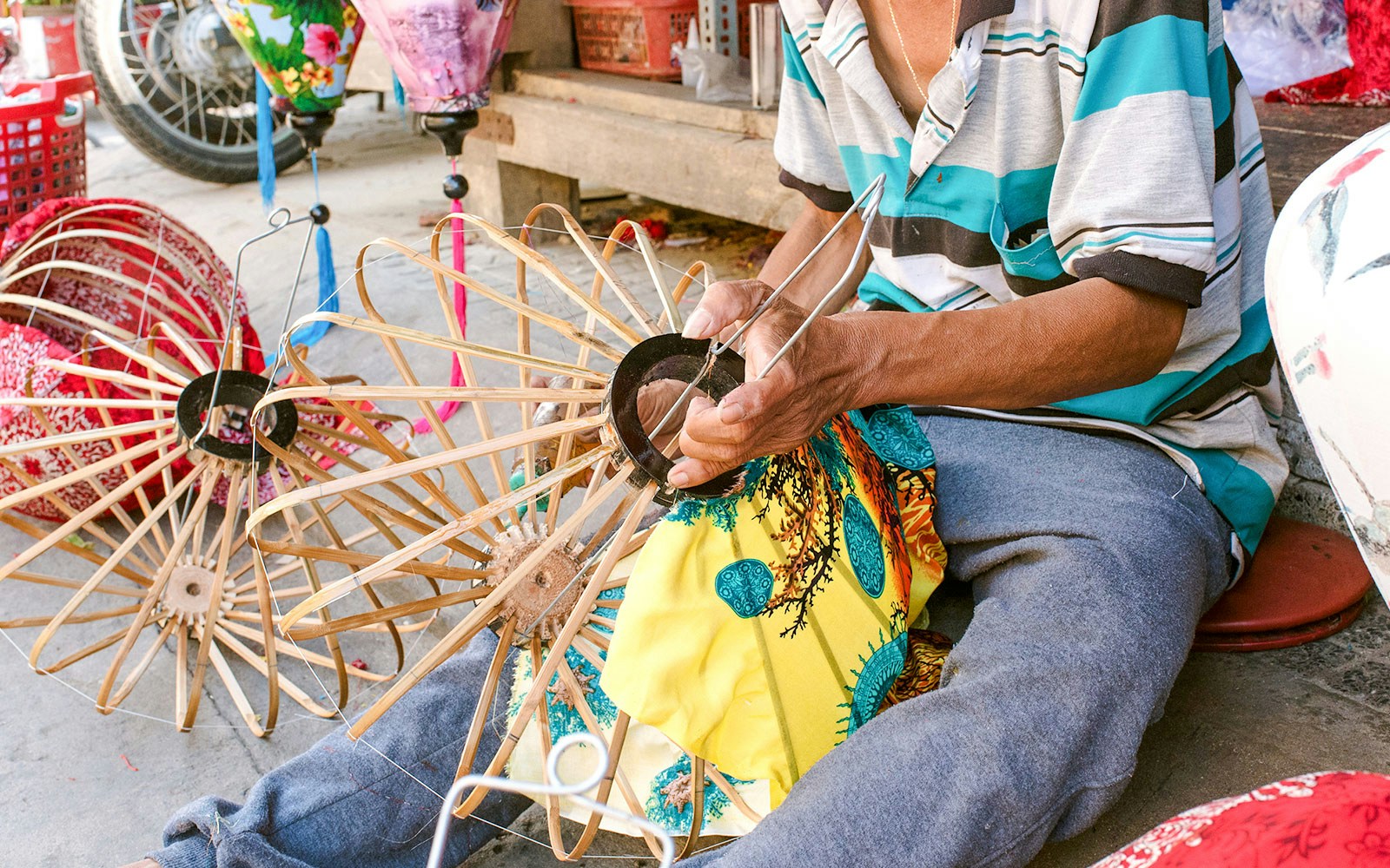 Man crafting traditional Vietnamese lanterns in Hoi An.