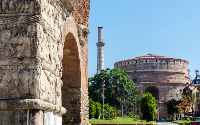 Arch of Galerius with detailed carvings and the Rotunda in Thessaloniki, Greece.