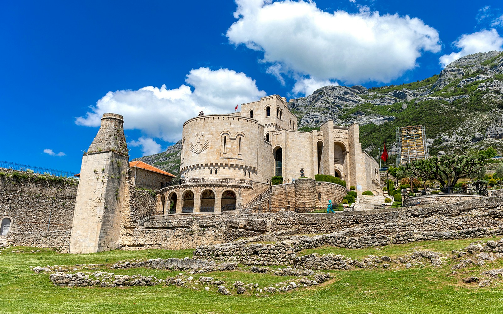 Kruja Castle with stone walls and mountainous backdrop in Albania.