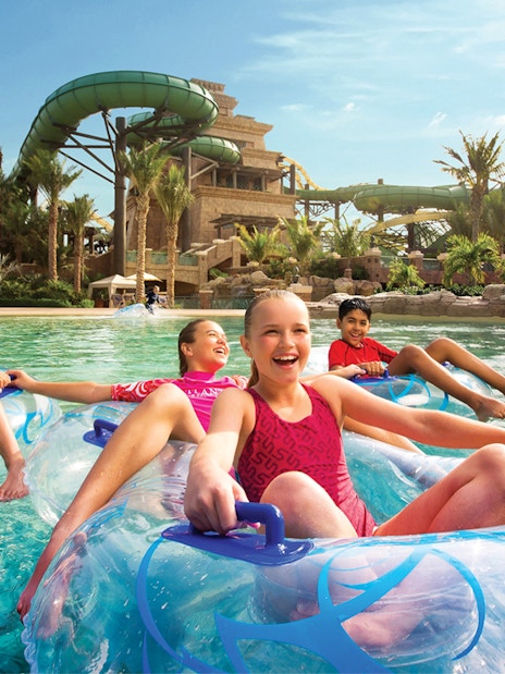 Children enjoying water rides at Aquaventure Waterpark, Atlantis The Palm, Dubai.