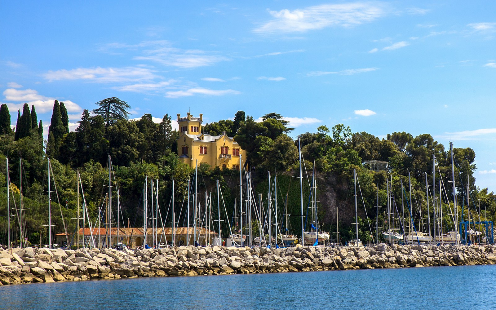 Miramare Castle's Castelletto surrounded by lush greenery in Trieste, Italy.