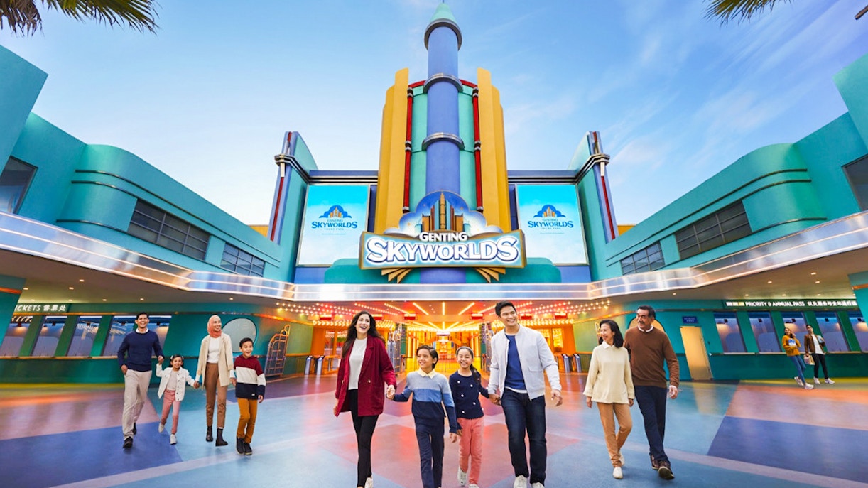 Families walking at the entrance of Genting SkyWorlds Theme Park.