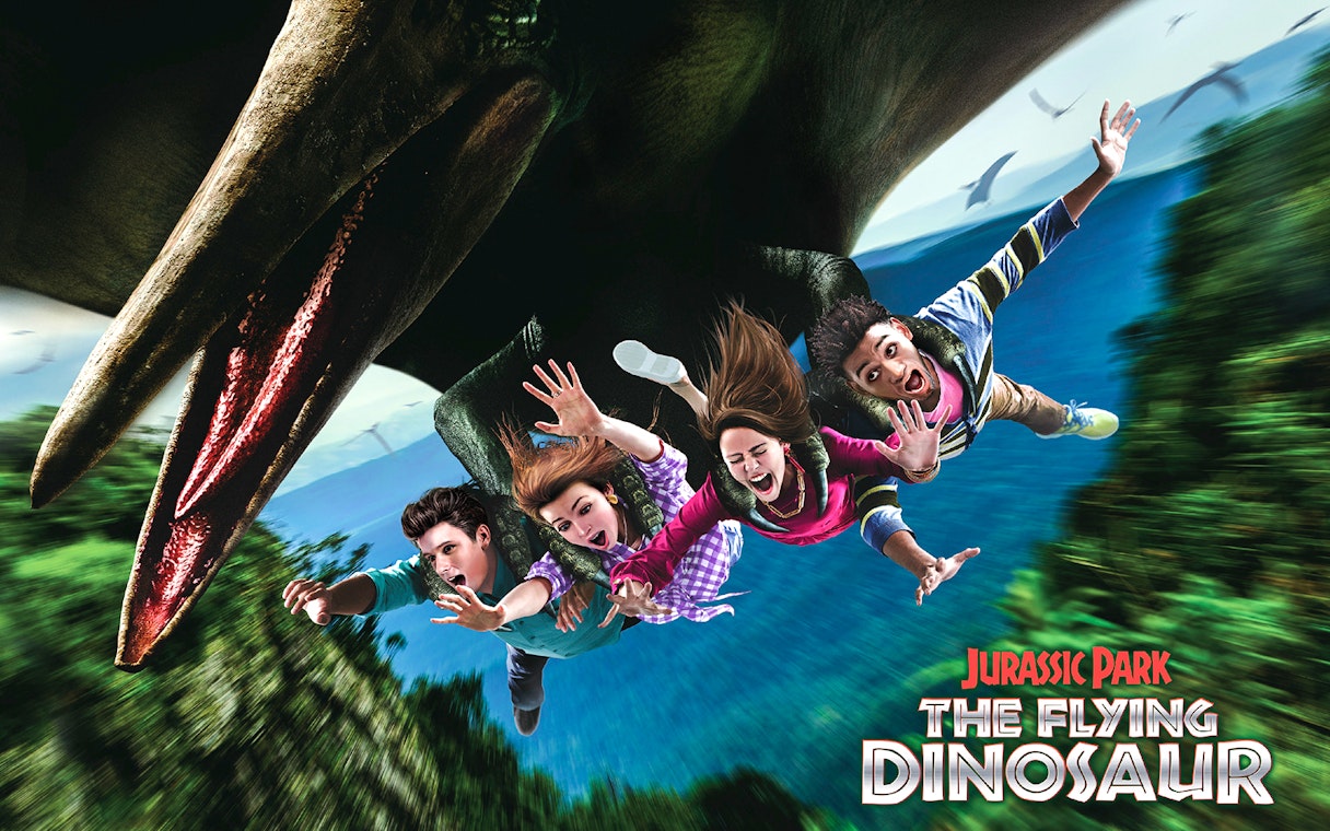 Tourists on The Flying Dinosaur ride at Universal Studios Japan.