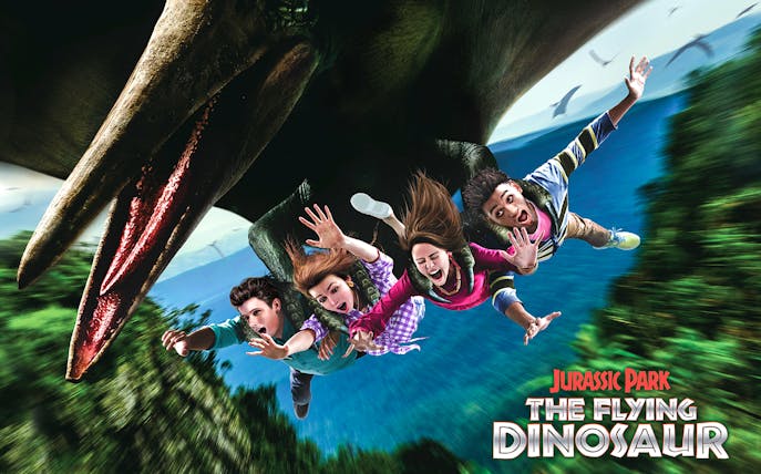 Tourists on The Flying Dinosaur ride at Universal Studios Japan.