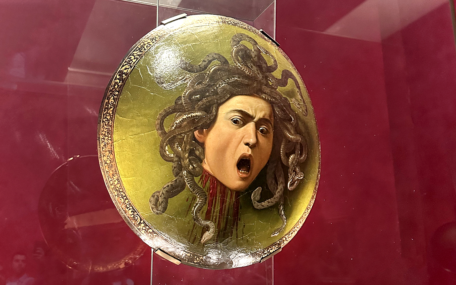 Shield featuring Medusa's head displayed in Uffizi Gallery, Florence.