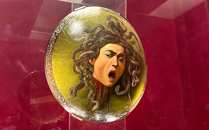 Shield featuring Medusa's head displayed in Uffizi Gallery, Florence.