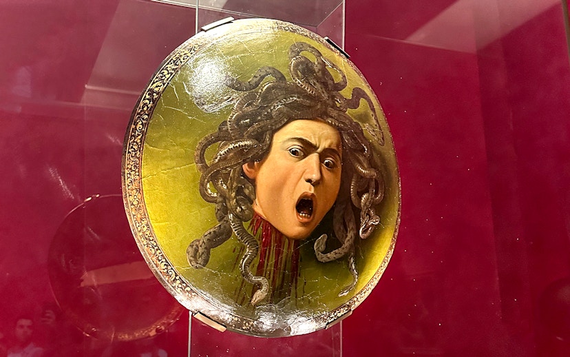 Shield featuring Medusa's head displayed in Uffizi Gallery, Florence.