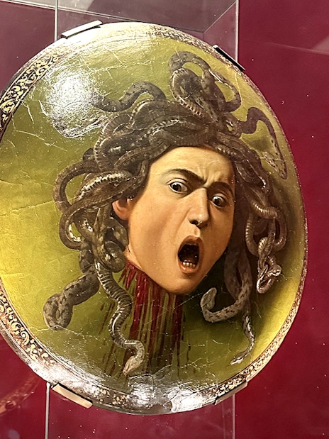 Shield featuring Medusa's head displayed in Uffizi Gallery, Florence.