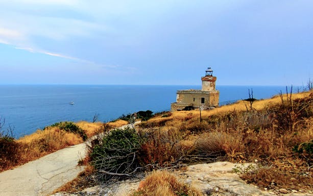 Lighthouse on a hill overlooking the sea near Vieste on the ferry route to Tremiti Islands.
