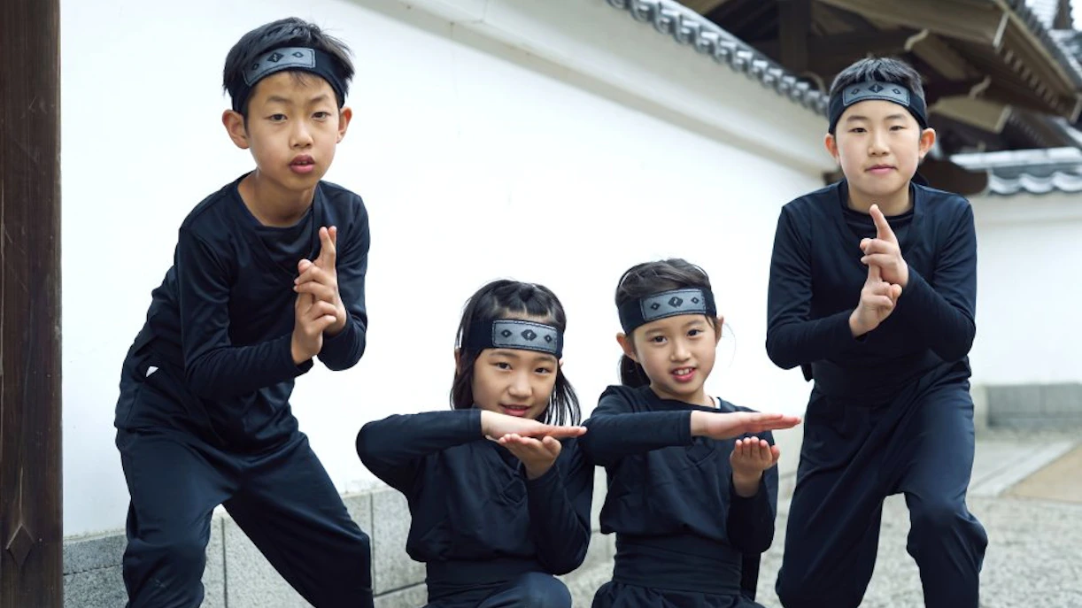 Children dressed as ninjas at Edo Wonderland Nikko Edomura, Japan.