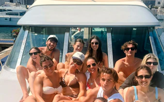 Group enjoying a boat tour in Mondello, Palermo.